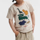 Liewood T-shirt för pojkar Apia Placement Dinosaurs / Sandy
